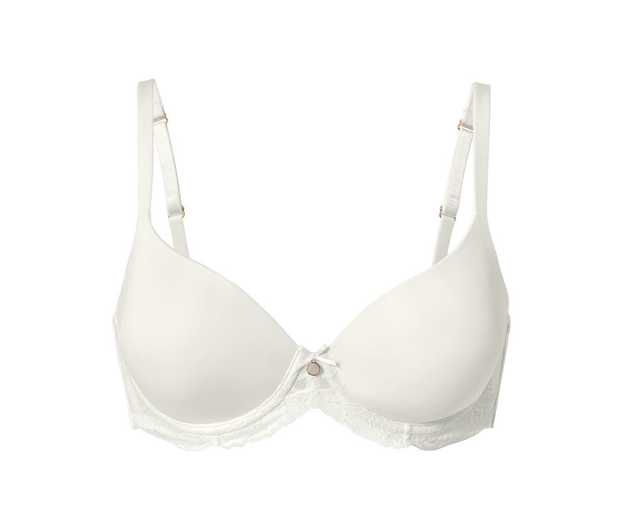 Un soutien-gorge à coques couleur crème à mémoire de forme sur fond blanc.