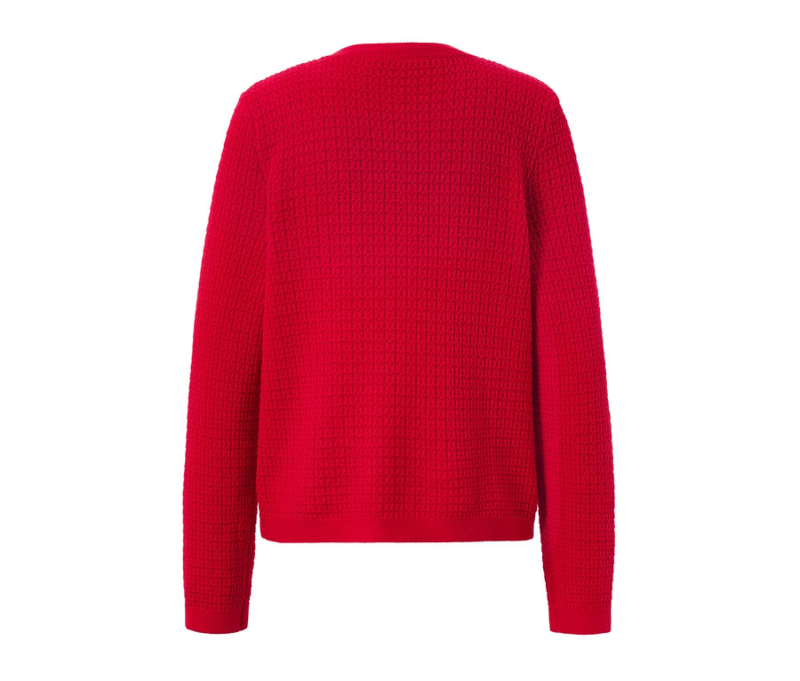 Vue détaillée d'un cardigan rouge en maille structurée.