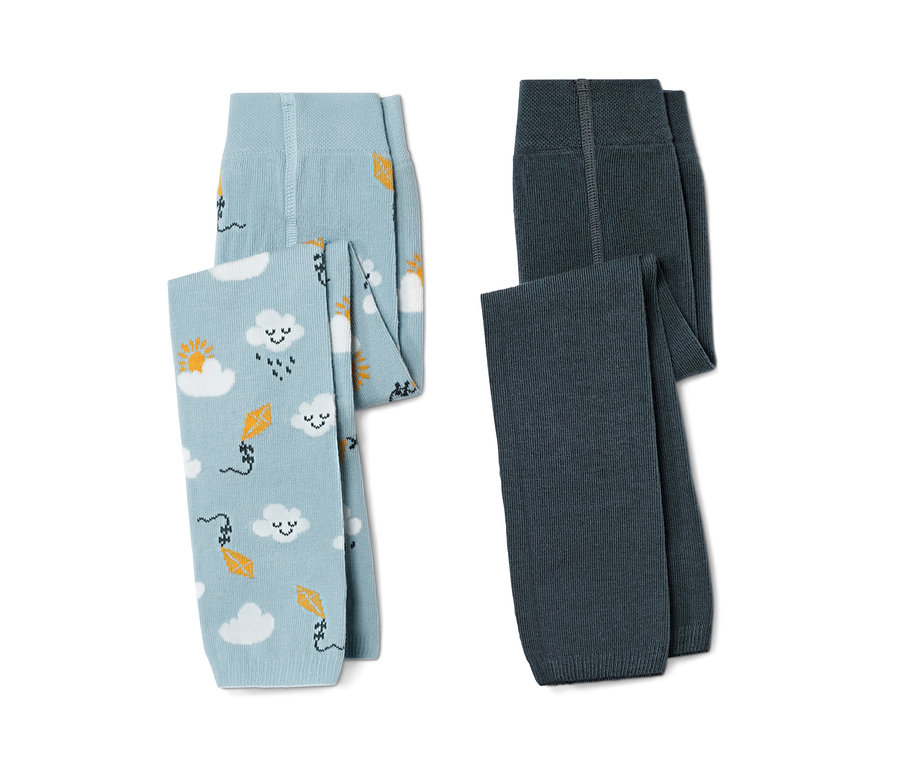 Deux collants en tricot pour tout petit : un bleu clair avec des motifs de nuages et de cerfs-volants et un bleu foncé.