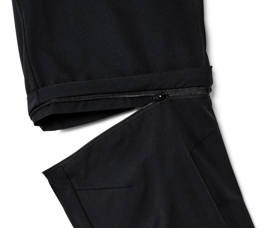 Détail d'un pantalon fonctionnel 2 en 1 noir avec fermeture éclair.