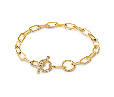 Bracelet Toggle doré avec insert de cristaux sur fond blanc.