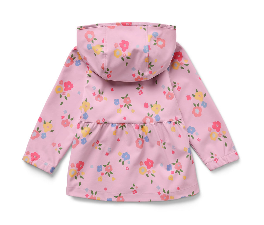 Détail d'une veste softshell pour enfant avec un motif floral.