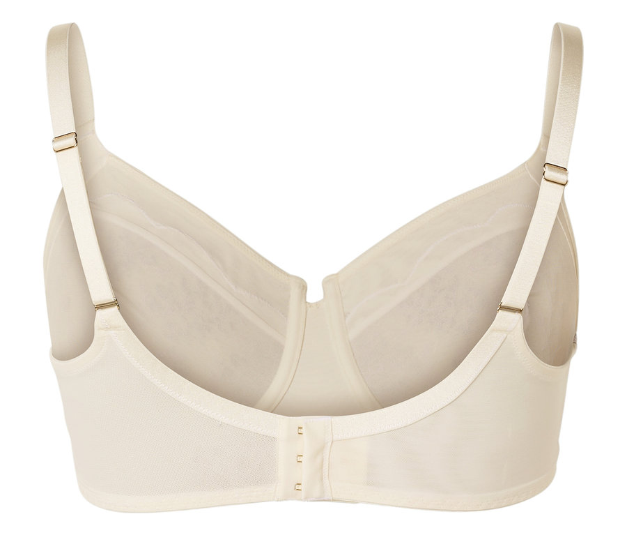 Gros plan sur le dos d'un soutien-gorge couleur crème avec des bretelles réglables et une fermeture à agrafes.