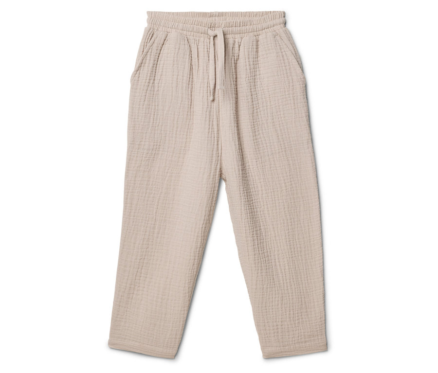 Pantalon beige en tissu avec cordon de serrage sur fond blanc.