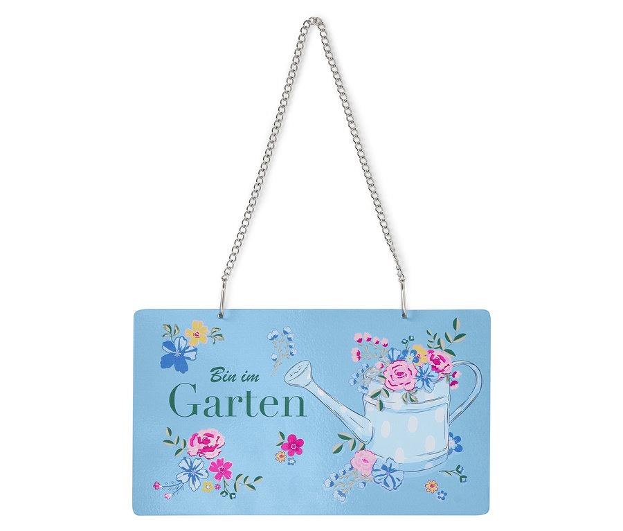 Panneau avec l'inscription "Bin im Garten" orné d'un arrosoir et de fleurs.