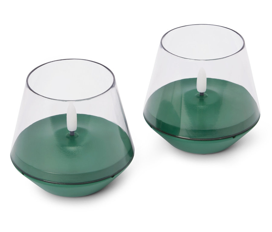 Deux bougies chauffe-plat électriques vertes sur fond blanc.