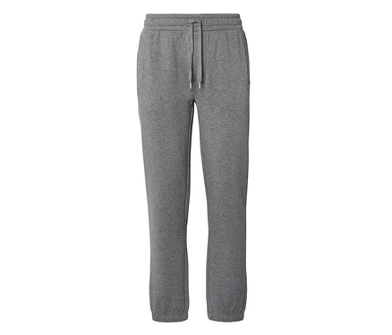 Pantalon de jogging gris avec taille élastique, cordon de serrage, poches latérales et chevilles élastiques.