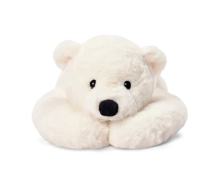 Ours polaire en peluche blanc et moelleux, allongé, les pattes avant repliées sous la tête, regardant vers l'avant.