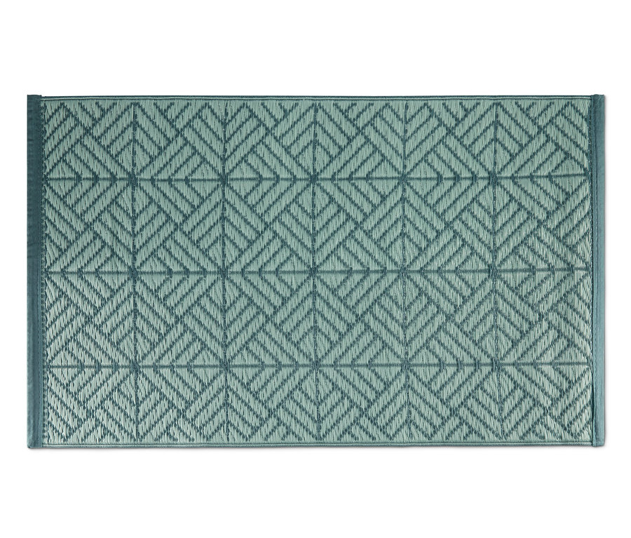 Tapis d'extérieur vert avec un motif géométrique.