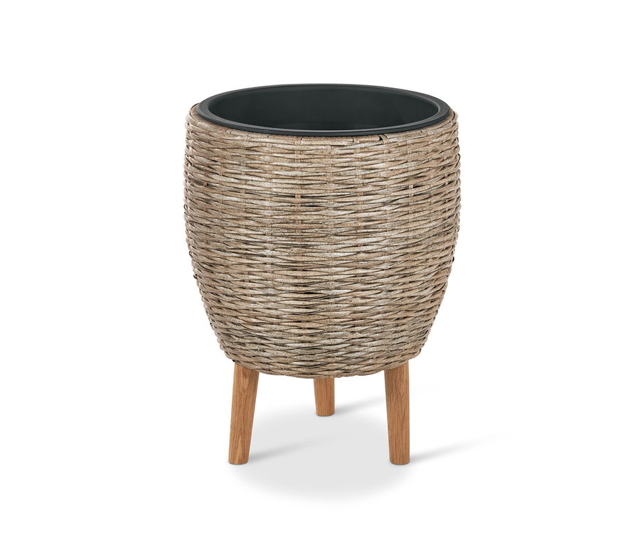 Pot de fleurs beige avec pieds en polyrotin.