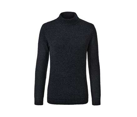 Gros plan d'un pull en maille.
