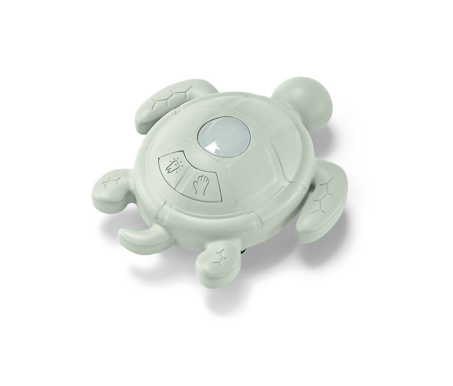 Un minuteur vert en forme de tortue pour se laver les mains et se brosser les dents.