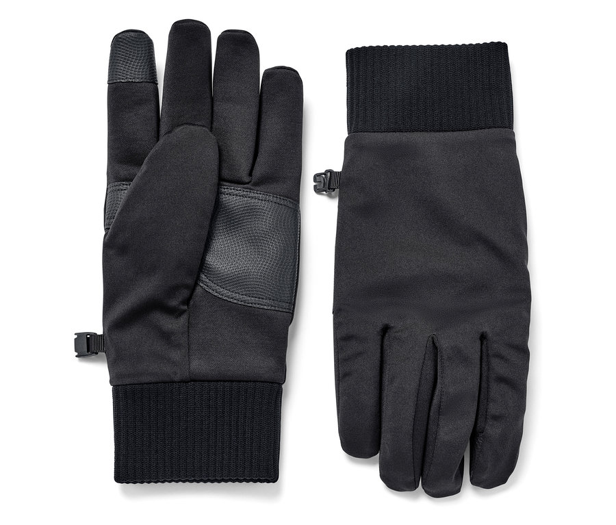 Deux gants noirs en softshell sont posés l'un à côté de l'autre.