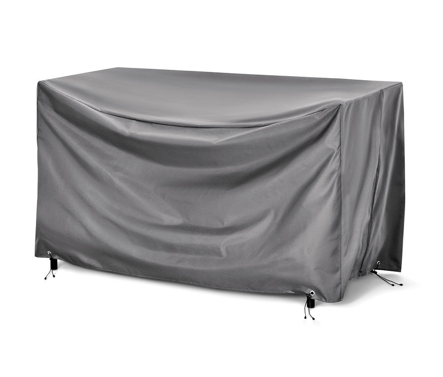 Une housse de protection premium grise pour grands sofas lounge recouvre des meubles.