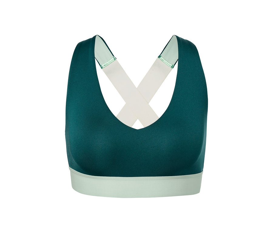 Brassière de sport verte avec bretelles croisées.