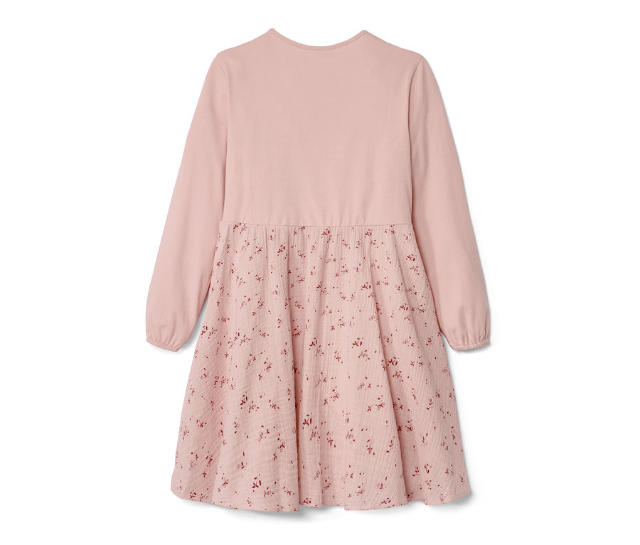 Robe tisée rose pour enfant avec manches longues et motif floral sur la jupe.