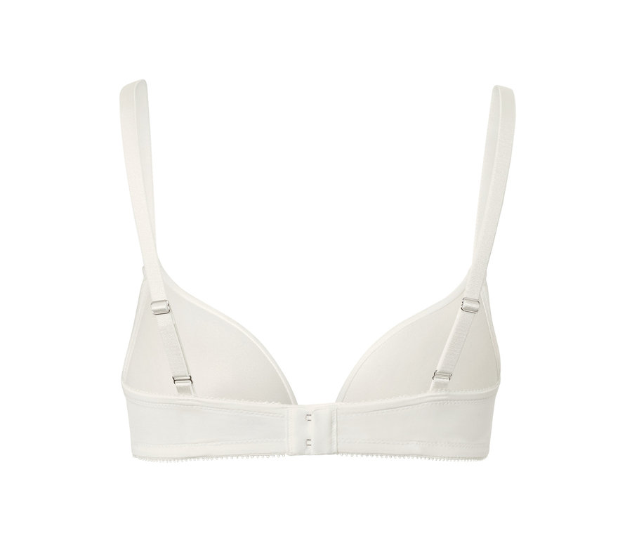 Détail d'un soutien-gorge push-up blanc avec bretelles réglables et fermeture à agrafes.