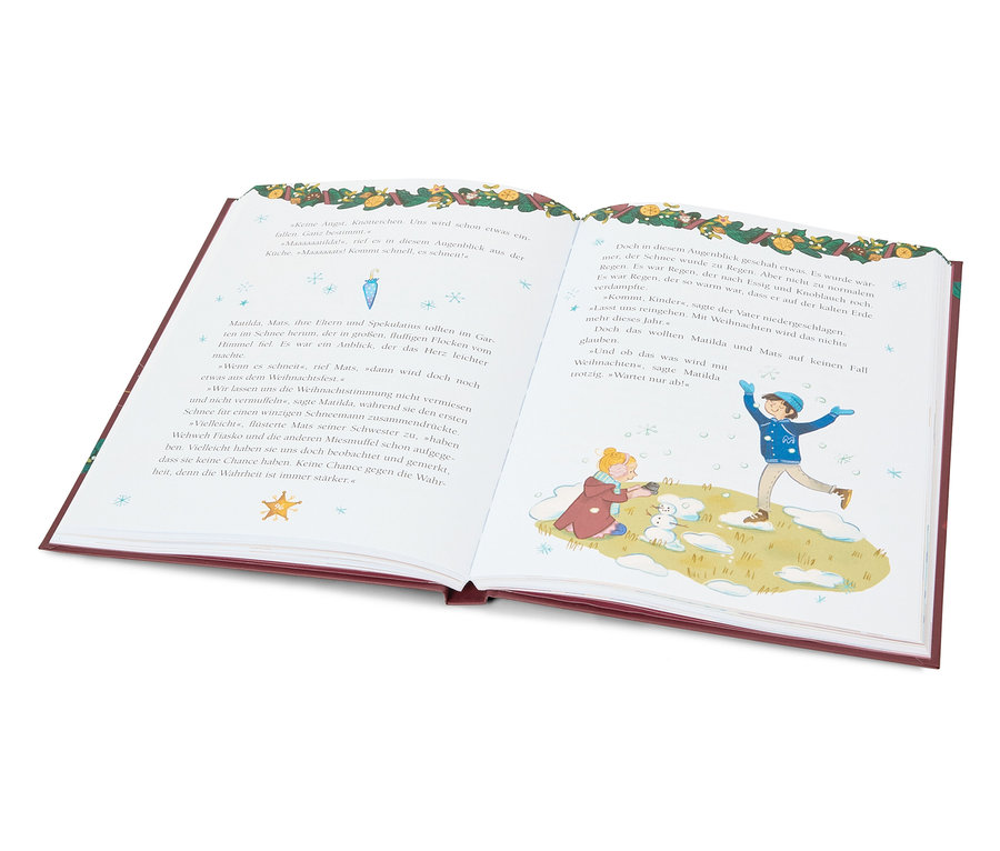 Livre ouvert illustrant deux enfants jouant dans la neige.