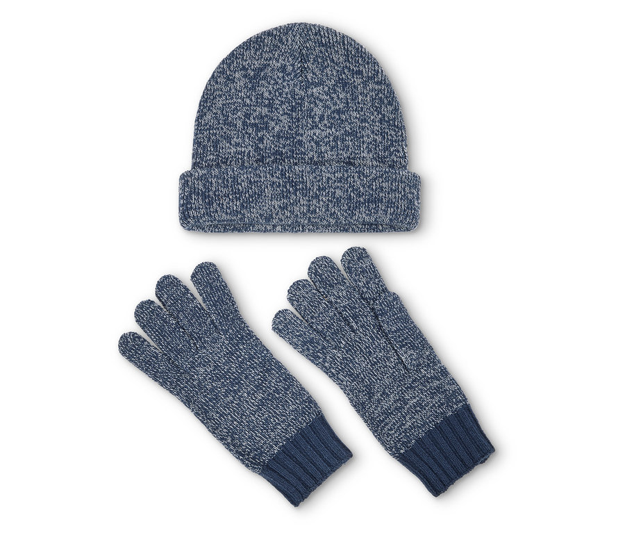 Un bonnet en tricot bleu et une paire de gants sur fond blanc.