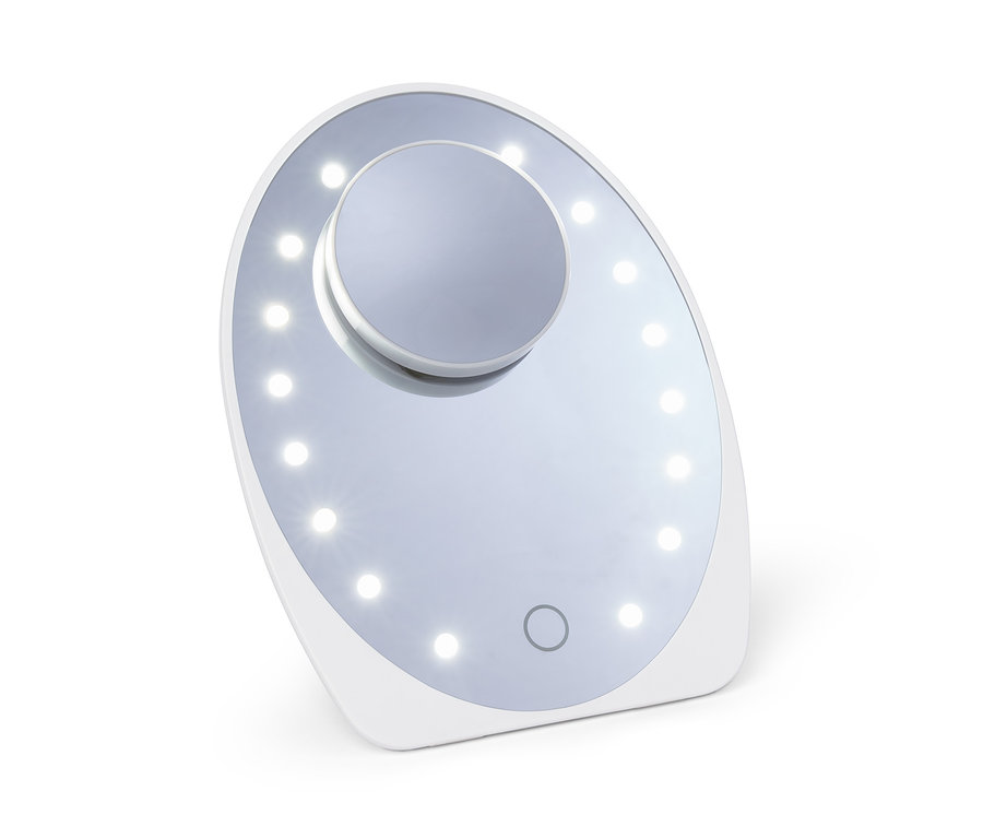 Un miroir cosmétique à LED blanc sur fond blanc.