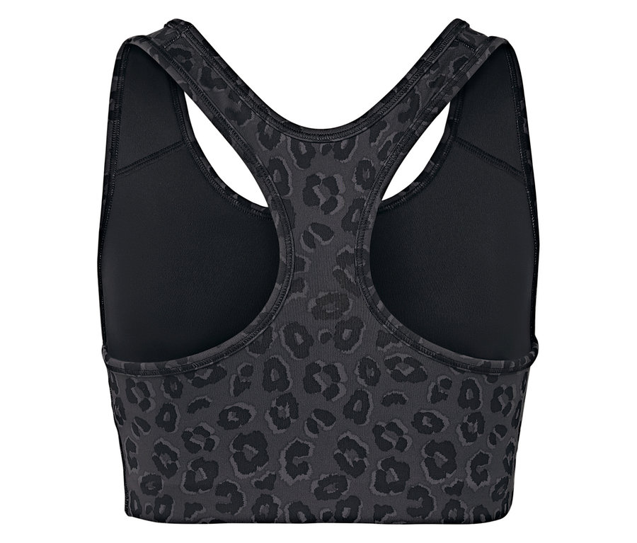 Gros plan d'une brassière de sport à motif léopard avec dos nageur.