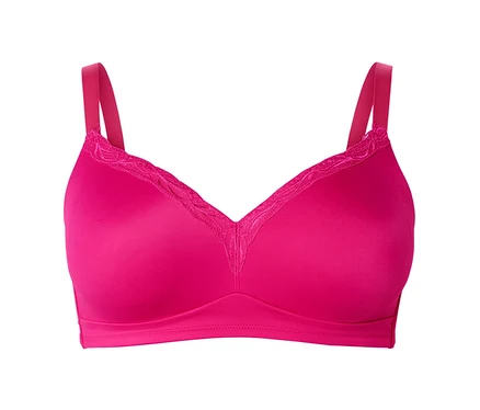 Gros plan d'un soutien-gorge souple rose avec de la dentelle sur un fond blanc.
