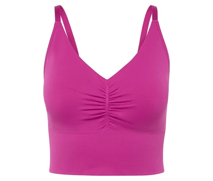 Gros plan d'une brassière de sport rose avec de fines bretelles.