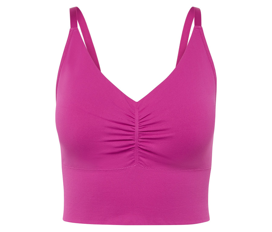 Gros plan d'une brassière de sport rose avec de fines bretelles.