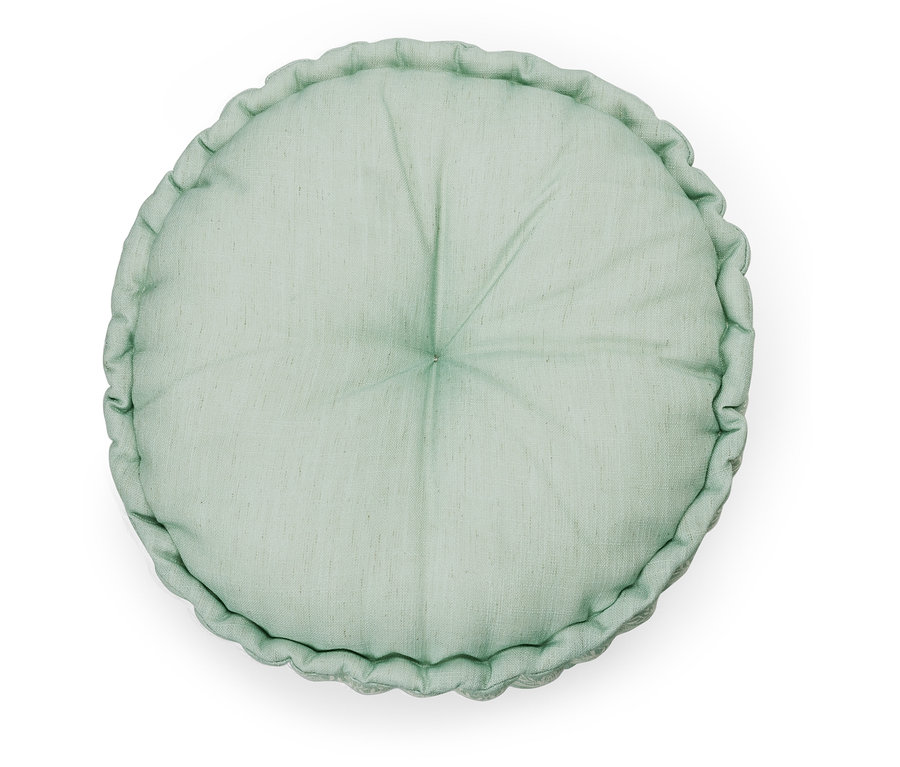 Coussin de sol rond vert.