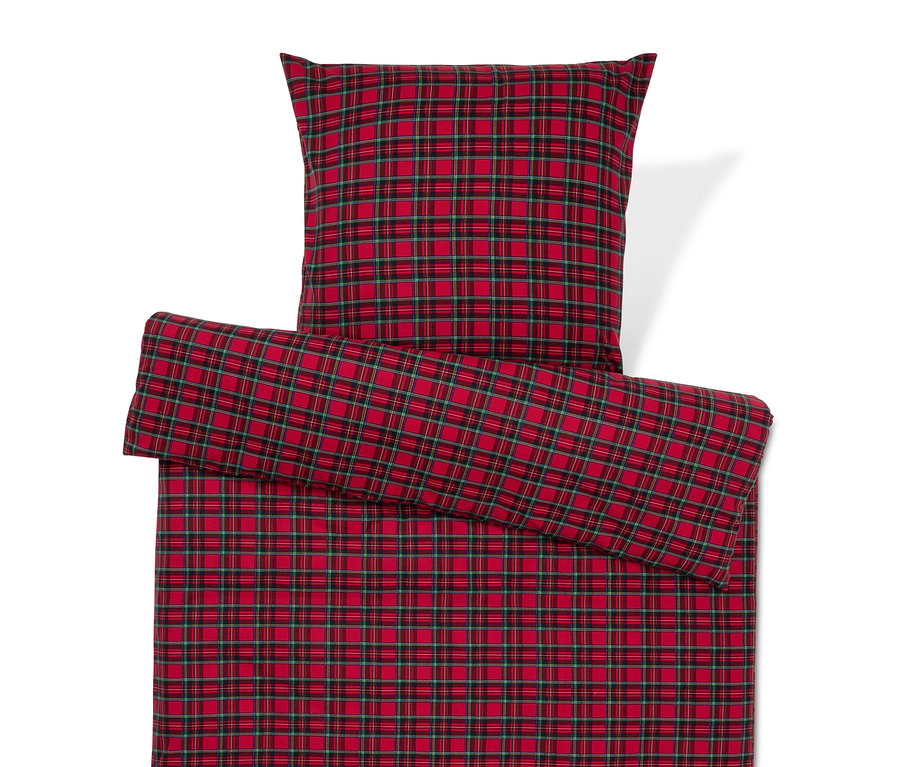 Linge de lit à carreaux rouges avec oreiller.