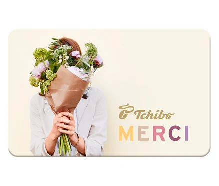 Une femme tenant un bouquet de fleurs devant son visage sur une carte cadeau avec l'inscription Tchibo Merci. E-carte cadeau - Merci