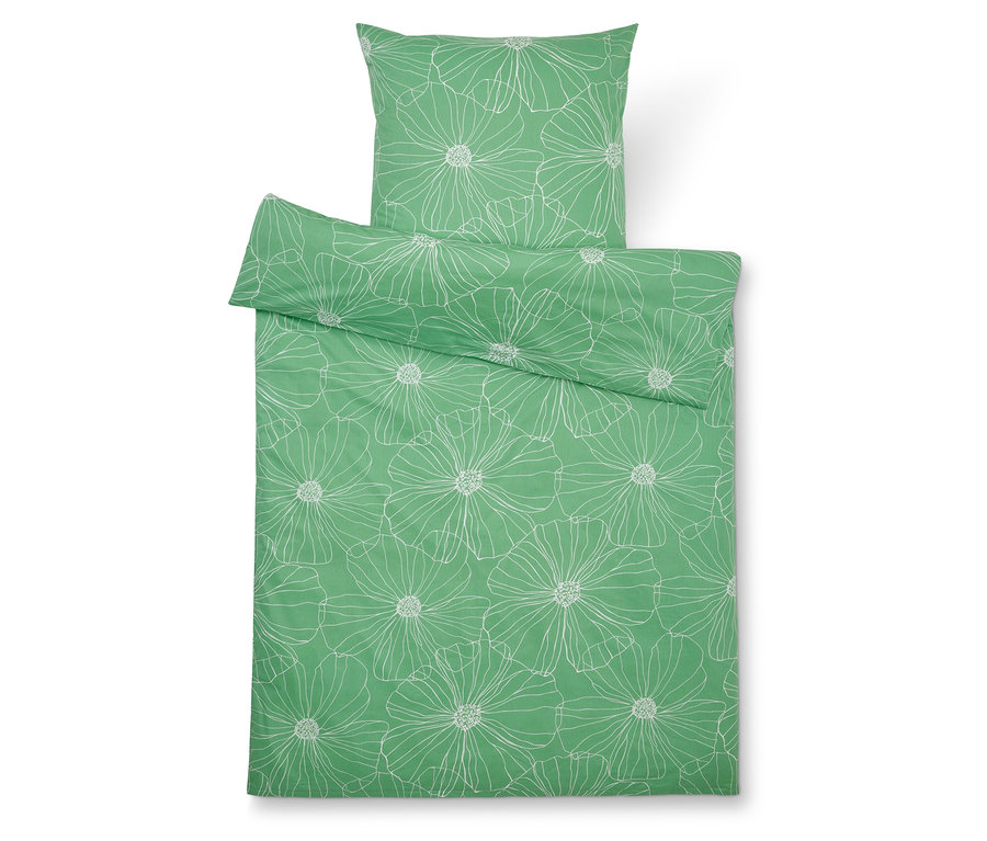 Linge de lit vert à motifs floraux blancs comprenant une taie d'oreiller et une housse de couette.