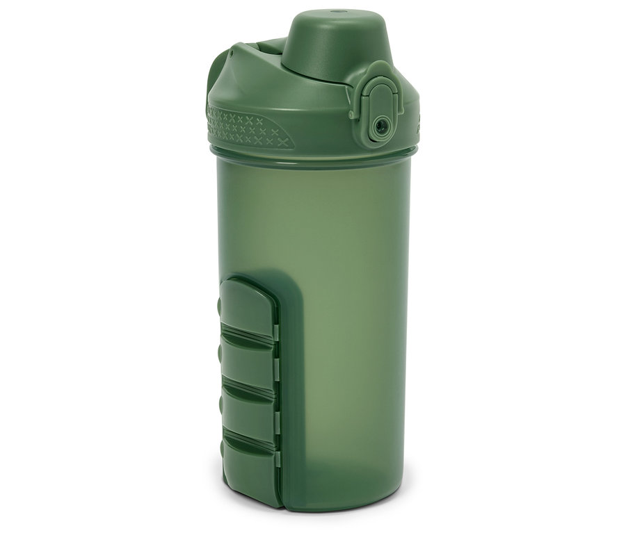 Bouteille de shaker verte avec couvercle et compartiment à pilules intégré.