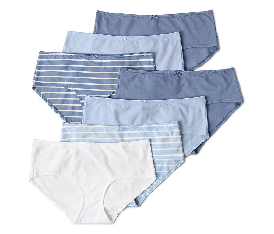 Sept culottes pour femmes dans différentes nuances de bleu et de blanc, empilées.
