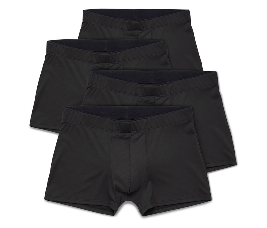 Trois boxers noirs pour hommes sont empilés sur un fond blanc.