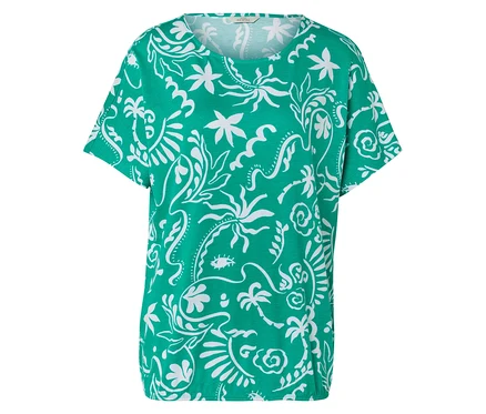 T-shirt vert avec motif tropical blanc.