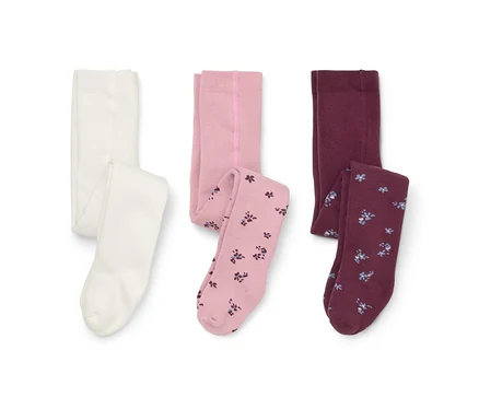 Trois paires de collants sur fond blanc : une blanche, une rose clair avec jambes à motif floral et une bordeaux avec jambes à motif floral.