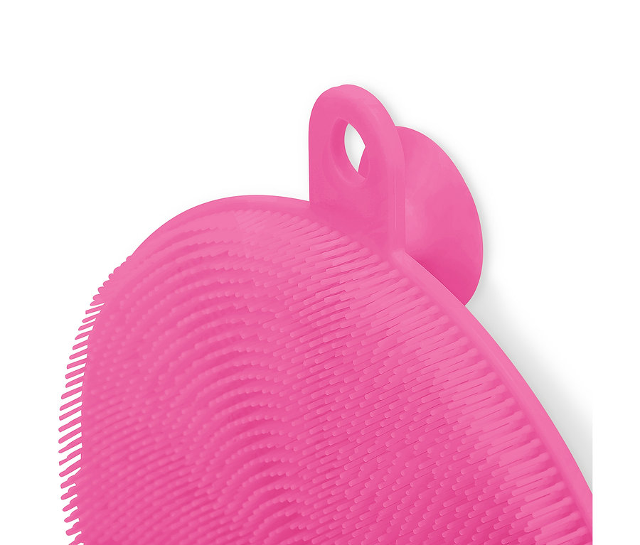 Gros plan d'une brosse en silicone rose avec boucle et picots.