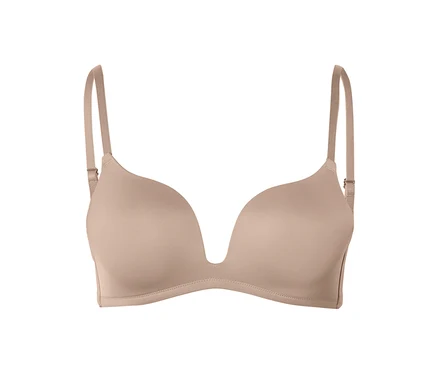 Soutien-gorge push-up beige avec décolleté en V profond et bretelles réglables.