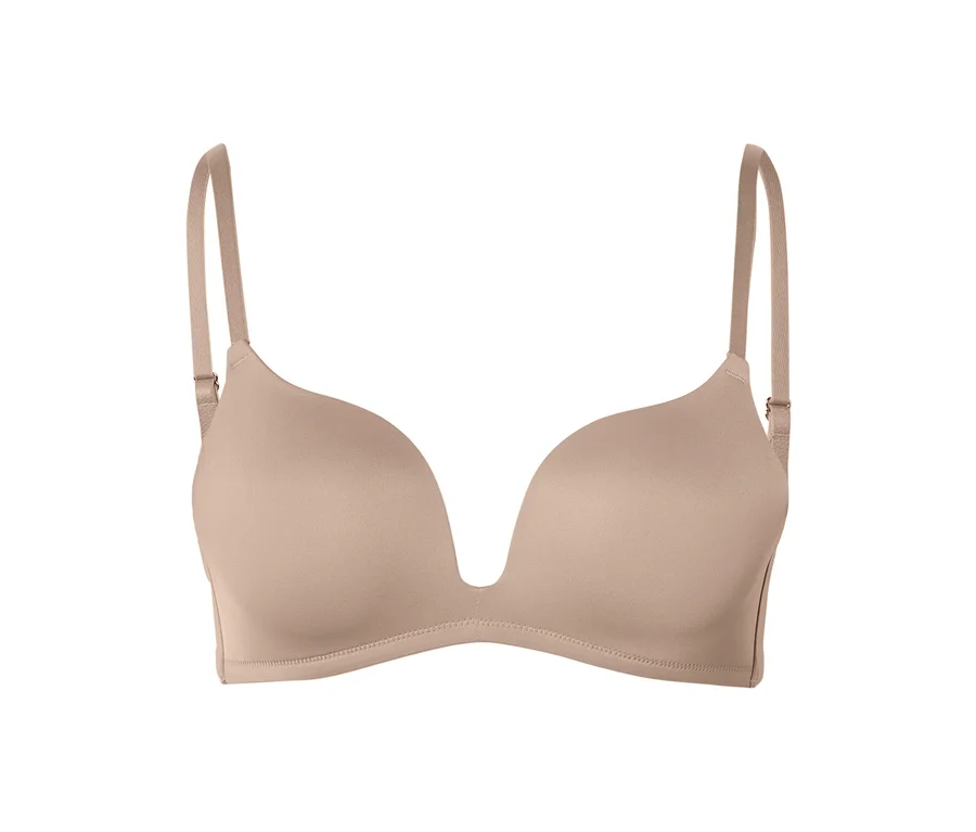 Soutien-gorge push-up beige avec décolleté en V profond et bretelles réglables.