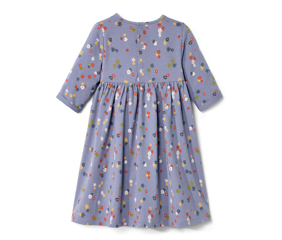 Une robe en jersey bleu pour bébé avec un imprimé floral intégral.
