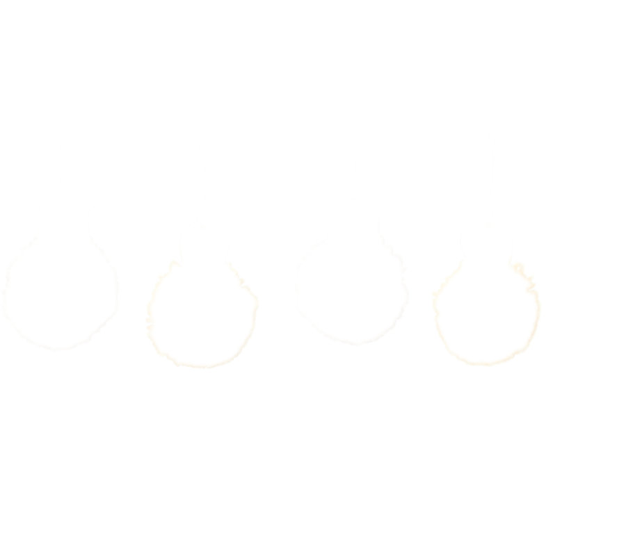 Quatre pompons de Pâques du kit de construction pour pompons de Pâques.