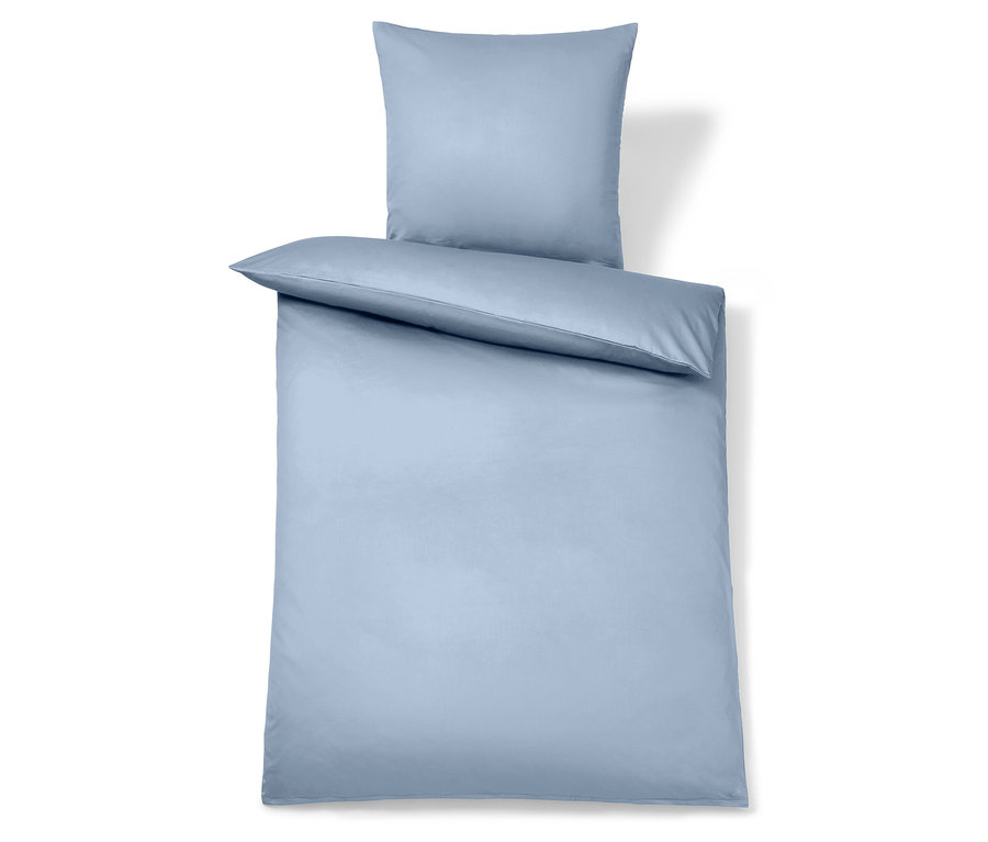 Linge de lit bleu clair pour oreiller et couette.