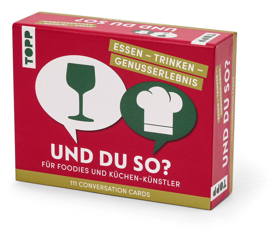 Une boîte rouge avec l'inscription « UND DU SO ? ». Sur la boîte, il y a une image d'un verre à vin et d'une toque de chef.
