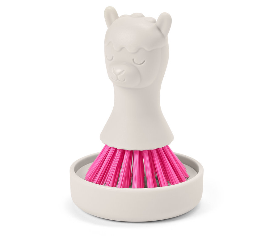 Une brosse grise à poils roses en forme de lama dans un support gris.