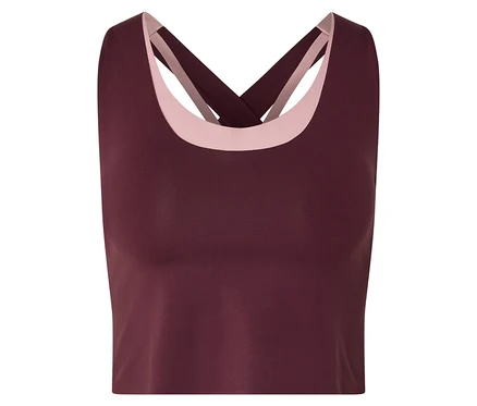 Haut de sport bordeaux avec bretelles croisées et détails roses à l'encolure.