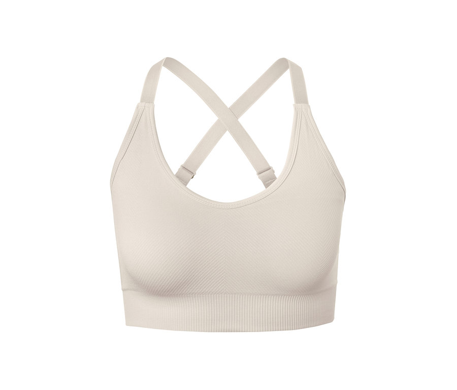 Détail d'une brassière de sport sans coutures, blanc cassé.