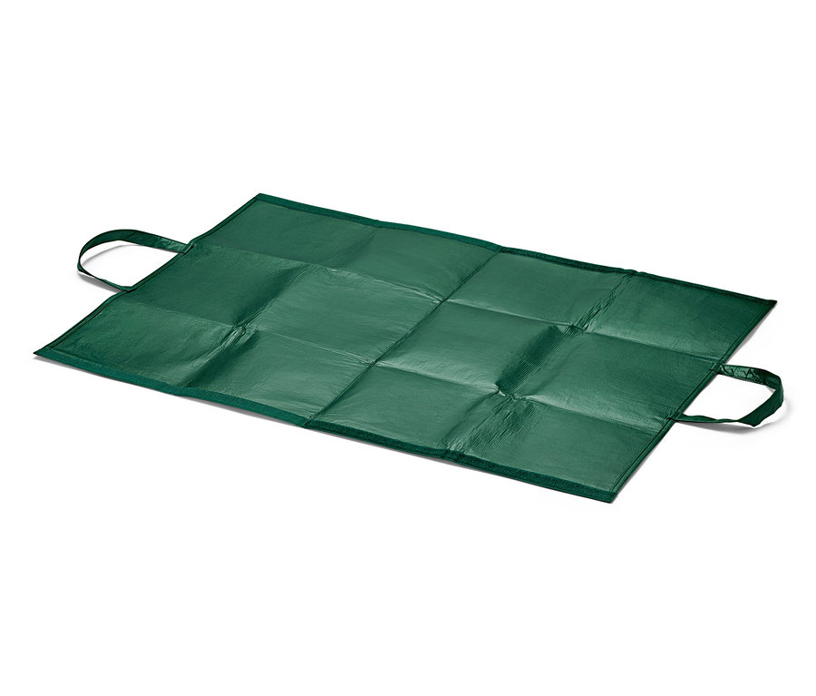 Un sac à déchets de jardin vert posé à plat sur un fond blanc.