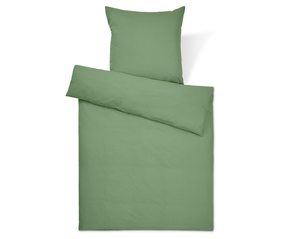 Linge de lit vert avec oreiller et couette.