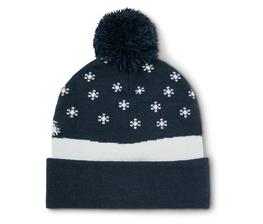 Bonnet tricoté bleu marine avec flocons de neige blancs et pompon.